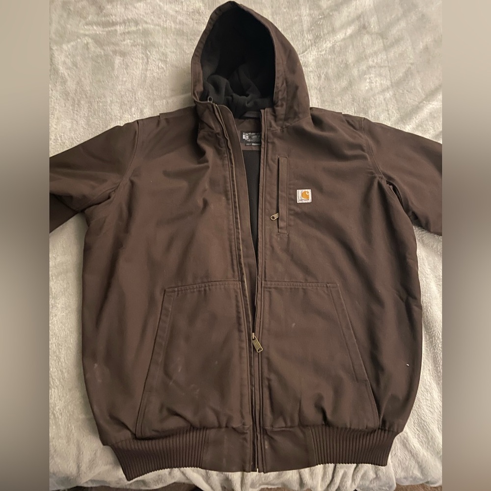 Carhartt heavy winter coat with hood. Size XLT dark brown. Plenty of pockets